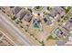 Aerial view of the neighborhood with solar panels, green turf, and white fences at 4804 Marcos Cir, Kissimmee, FL 34758