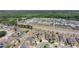 An aerial view of a community featuring single-Gathering homes, a road, and a green space, showcasing neighborhood layout at 4804 Marcos Cir, Kissimmee, FL 34758