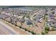 An aerial shot displays neighborhood with homes, green space, and a pond, showcasing the community's serene layout at 4804 Marcos Cir, Kissimmee, FL 34758