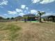 Expansive backyard featuring a covered patio and ample space for outdoor activities at 4804 Marcos Cir, Kissimmee, FL 34758