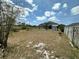 A spacious backyard featuring a shed, privacy fence, and potential for landscaping, offering outdoor possibilities at 4804 Marcos Cir, Kissimmee, FL 34758
