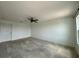 This bedroom boasts a ceiling fan, and a large window, providing great light at 4804 Marcos Cir, Kissimmee, FL 34758