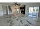 Open-concept living space featuring modern marble floors and a sleek kitchen island with stainless appliances at 4804 Marcos Cir, Kissimmee, FL 34758