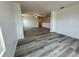 Spacious living area with stylish wood flooring and ample natural light, perfect for relaxation and gatherings at 4804 Marcos Cir, Kissimmee, FL 34758