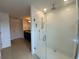 Modern bathroom featuring a glass shower with white tiling and rainfall showerhead at 4804 Marcos Cir, Kissimmee, FL 34758