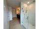 Modern bathroom featuring a glass shower with white tiling and rainfall showerhead at 4804 Marcos Cir, Kissimmee, FL 34758