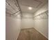 Spacious walk-in closet with carpet and wire shelving around the perimeter at 4804 Marcos Cir, Kissimmee, FL 34758