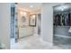 Modern bathroom featuring a walk-in shower, marble floors, and a walk-in closet at 483 Stillwater Dr, Oviedo, FL 32765