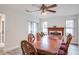 Dining room featuring a wooden dining table, six chairs, and a fireplace at 483 Stillwater Dr, Oviedo, FL 32765