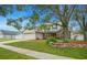 Charming two-story home featuring a well-manicured lawn and a welcoming two-car garage at 483 Stillwater Dr, Oviedo, FL 32765