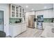 Galley kitchen featuring white cabinets, granite counters, and stainless appliances at 483 Stillwater Dr, Oviedo, FL 32765