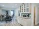 Galley kitchen featuring white cabinets, granite counters, and stainless appliances at 483 Stillwater Dr, Oviedo, FL 32765