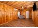 Living room features a wooden ceiling, wood paneling, and laminate flooring at 502 Engel Dr, Orlando, FL 32807