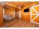 Living room features a wooden ceiling, wood paneling, and laminate flooring at 502 Engel Dr, Orlando, FL 32807
