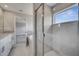 This primary bathroom features a modern tiled shower with a glass enclosure at 502 Viceroy Ct, Kissimmee, FL 34758