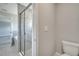 This primary bathroom offers a modern tile shower with glass door and neutral gray paint at 502 Viceroy Ct, Kissimmee, FL 34758