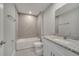 Bathroom features a granite vanity, sleek fixtures, and a tiled shower-tub combination at 502 Viceroy Ct, Kissimmee, FL 34758
