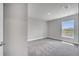 This bedroom features carpet flooring, a window, and neutral paint at 502 Viceroy Ct, Kissimmee, FL 34758