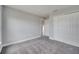 Spacious bedroom features neutral-toned walls, carpet, and ample closet space at 502 Viceroy Ct, Kissimmee, FL 34758