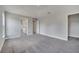 This bedroom features neutral tones, an ensuite bathroom and spacious walk in closet at 502 Viceroy Ct, Kissimmee, FL 34758