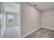This spacious closet includes carpet flooring, neutral paint, and shelving for storage at 502 Viceroy Ct, Kissimmee, FL 34758