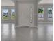 Bright foyer with tile flooring, natural light, and views of the surrounding neighborhood at 502 Viceroy Ct, Kissimmee, FL 34758