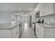 Close-up of a kitchen with granite countertops, modern appliances, and white cabinets at 502 Viceroy Ct, Kissimmee, FL 34758