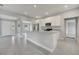 Spacious kitchen with a central island, stainless appliances, and modern white cabinets at 502 Viceroy Ct, Kissimmee, FL 34758