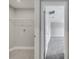 Laundry room with wire shelving, neutral walls, and doorway to the carpeted second floor at 502 Viceroy Ct, Kissimmee, FL 34758