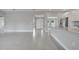 Open-concept living area featuring stylish tile flooring, a bright airy space with an open kitchen at 502 Viceroy Ct, Kissimmee, FL 34758