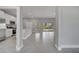 Inviting living space with modern tile flooring and an open flow into the kitchen area at 502 Viceroy Ct, Kissimmee, FL 34758