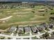 Aerial view of homes overlooking a scenic golf course, in a well-planned community at 520 Prestwick Dr, Davenport, FL 33897