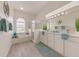 Bright bathroom featuring a soaking tub, walk-in shower, double sink vanity with ample counter space at 520 Prestwick Dr, Davenport, FL 33897