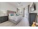 Spacious bedroom features a plush bed, modern furniture, decor, and a sliding glass door at 520 Prestwick Dr, Davenport, FL 33897