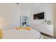 Bright bedroom features a TV, white dresser, and a comfortable bed with soft bedding at 520 Prestwick Dr, Davenport, FL 33897