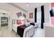 Bright bedroom featuring twin beds, racing decor, and cheerful Disney Cars themed pillows at 520 Prestwick Dr, Davenport, FL 33897