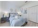 Bright bedroom features a plush bed, modern furniture, decor, and clean white walls at 520 Prestwick Dr, Davenport, FL 33897