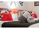 Cozy bedroom featuring twin beds, racing decor, and cheerful Disney Cars themed pillows at 520 Prestwick Dr, Davenport, FL 33897