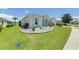 Well-manicured lawn and landscaping surround this beautiful single-story home at 520 Prestwick Dr, Davenport, FL 33897