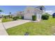 This single story house includes a paved driveway and attached two car garage at 520 Prestwick Dr, Davenport, FL 33897