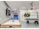 Bright game room featuring an air hockey table, a pool table, basketball game and Super Mario mural at 520 Prestwick Dr, Davenport, FL 33897