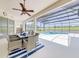 Enjoy outdoor dining in this screened-in lanai with ample seating and views of the pool and golf course at 520 Prestwick Dr, Davenport, FL 33897