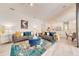 Open living room layout showcasing stylish furniture, contemporary decor, and seamless flow to the dining area at 520 Prestwick Dr, Davenport, FL 33897