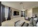 Spacious living room featuring comfortable seating, large TV, and Star Wars themed wall decor at 520 Prestwick Dr, Davenport, FL 33897