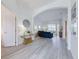Bright, open-concept living room featuring modern decor and seamless access to the outdoor space at 520 Prestwick Dr, Davenport, FL 33897