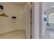 Bright walk-in closet with shelving and an en suite bathroom with a tub in view at 520 Prestwick Dr, Davenport, FL 33897