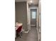 Hallway area that leads to a desk area, with gray walls and a modern design at 5306 Meadow Song Dr, Okahumpka, FL 34762