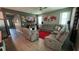 Spacious living room features plush seating, a modern TV, and coordinated decor at 5306 Meadow Song Dr, Okahumpka, FL 34762