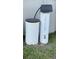 Water softener and filtration system is outside of the home on the grass at 5306 Meadow Song Dr, Okahumpka, FL 34762