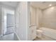 Bathroom featuring a bathtub-shower combo, vanity with granite countertop, and modern fixtures at 563 Viceroy Ct, Kissimmee, FL 34758